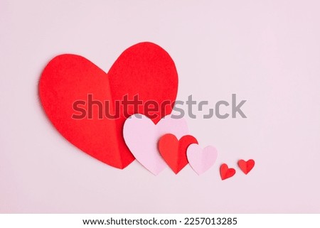 Red and Pink Paper Hearts on pink background, Heart shape papercut , Happy Valentine's day Royalty-Free Stock Photo #2257013285