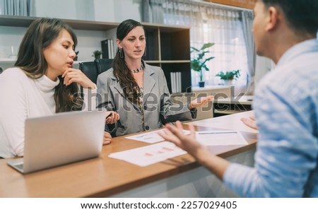 business caucasian and asian woman interview. annoyed human resource from industry having interview with employee candidate but disappointed. a new recruitment argument with uncomfortable employer. Royalty-Free Stock Photo #2257029405