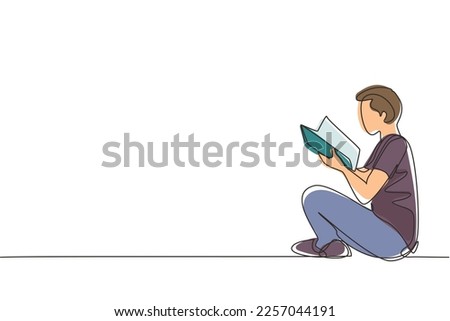 Single continuous line drawing teenage man in casual clothing sitting at floor and reading book. Enthusiastic reader for educational and hobby concept. One line draw graphic design vector illustration