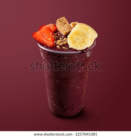 Frozen Acai Berry with Banana Strawberry and Pacoca. Isolated on Purple Background