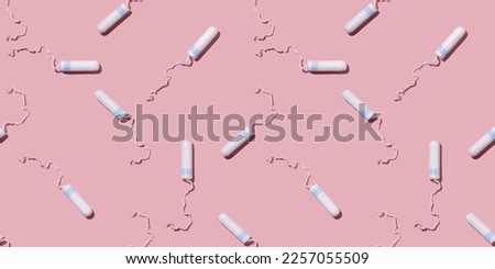 Women's tampons on a pink background pattern. Hygiene products for menstruation.