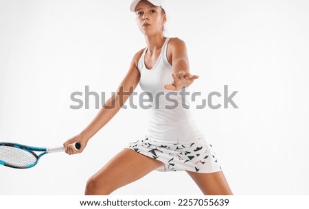 Tennis player. High-resolution photography for advertising the tennis academy and school. Girl athlete teenager with racket isolated on white background. Sport concept.