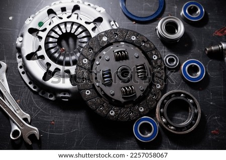 new clutch kit in a car service with a flywheel bearing before being installed on the car.