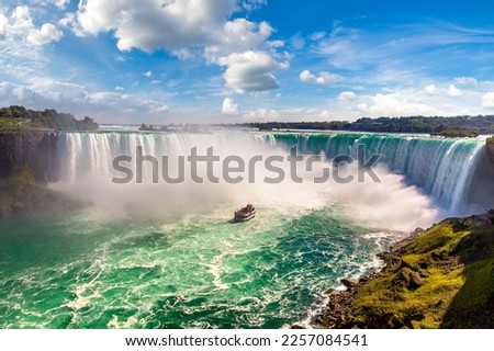 Canadian side view of Niagara Falls, Horseshoe Falls and boat tours in a sunny day  in Niagara Falls, Ontario, Canada Royalty-Free Stock Photo #2257084541