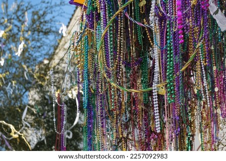 Background of colorful Mardi Gras beads