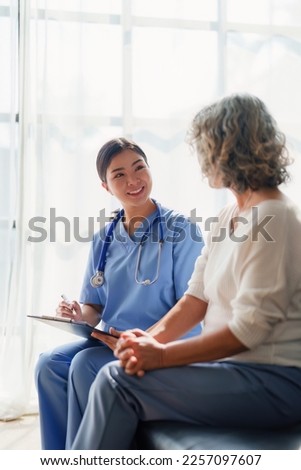 Home healthcare nurse, physical therapy with senior adult woman at home Royalty-Free Stock Photo #2257097607