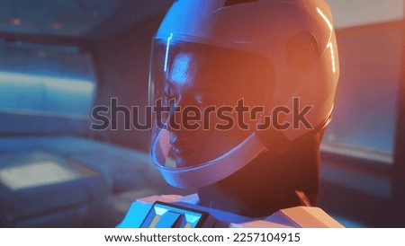 A woman astronaut in a space suit aboard the orbital station. A young female cosmonaut pilots a spaceship. Galactic travel and science concept. Royalty-Free Stock Photo #2257104915
