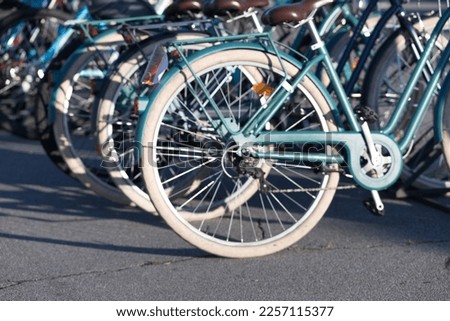 Defocused and blurred bicycles for rental on parking