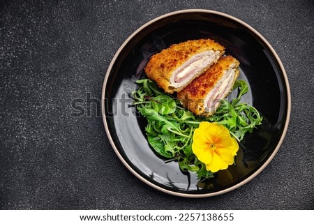cordon bleu cutlet chicken meat, cheese, bacon meal snack on the table copy space food background rustic top view Royalty-Free Stock Photo #2257138655