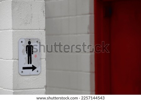 Men public toilet signage at the entrance of the restrooms