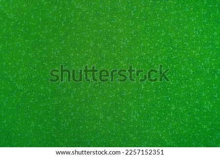 abstract green textured background with asymmetrical pattern, copy space
