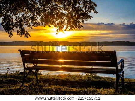 typical old wooden bench - parkbench - photo Royalty-Free Stock Photo #2257153911