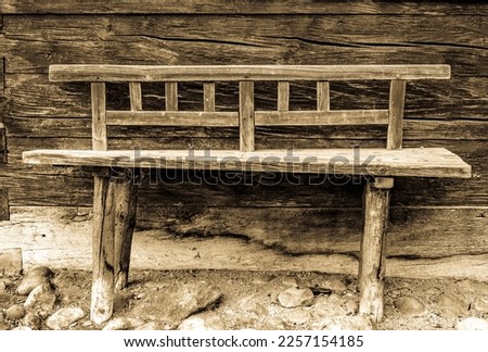 typical old wooden bench - parkbench - photo Royalty-Free Stock Photo #2257154185