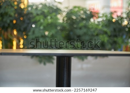 empty cafe table Empty wood table top and blur glass window interior restaurant banner mock up abstract background - can used for display or montage your products.