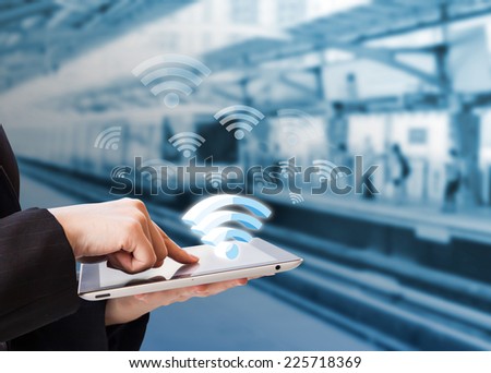 Businesswoman connecting to Wifi