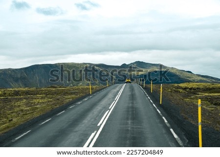 Empty road or highway in the natural environment of Iceland on a cloudy day