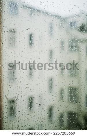 Symbol picture loneliness, depression, window pane with raindrops