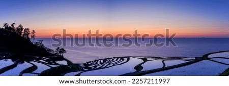 Panoramic scenery of the terraced rice fields and the Sea of Japan after sunset at Noto Peninsula, Ishikawa pref. Royalty-Free Stock Photo #2257211997