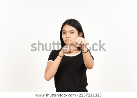 Punching fist to fight or angry Of Beautiful Asian Woman Isolated On White Background Royalty-Free Stock Photo #2257221325