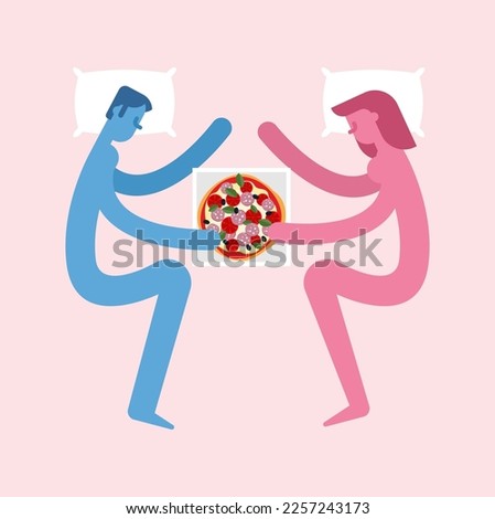 Couple in love is eating pizza in bed.