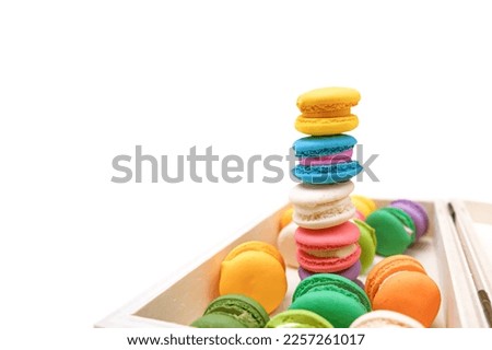 Colorful macaron or macaroons in a box isolated on white background, macarons high stack