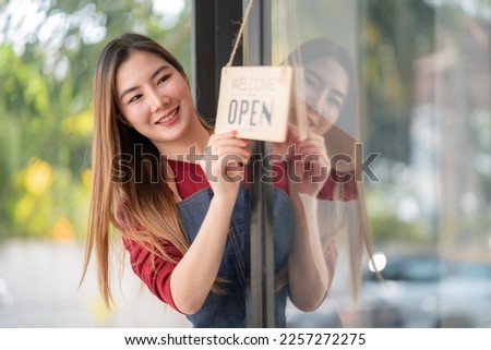 Welcome open shop barista waitress open sign on glass door modern coffee shop ready to serve restaurant cafe, retail small business owners.
