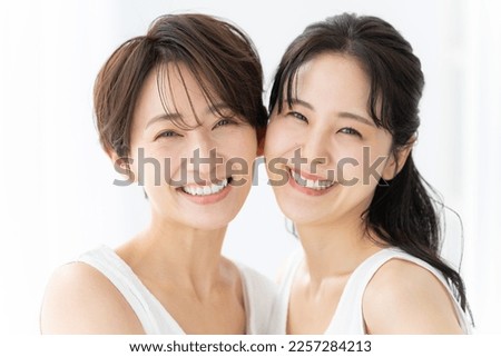 Smiling Asian women looking at the camera Royalty-Free Stock Photo #2257284213
