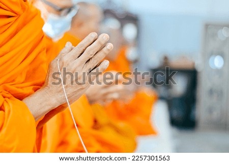 close up monk's hand praying in wedding ceremony wallpaper background