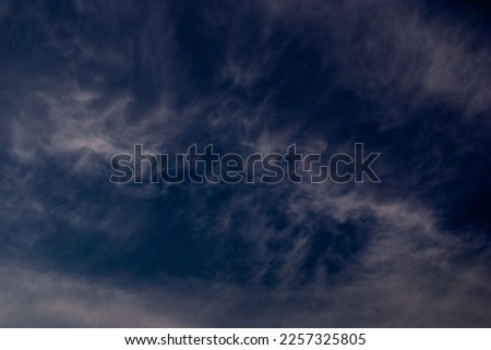 View on white clouds in the blue sky