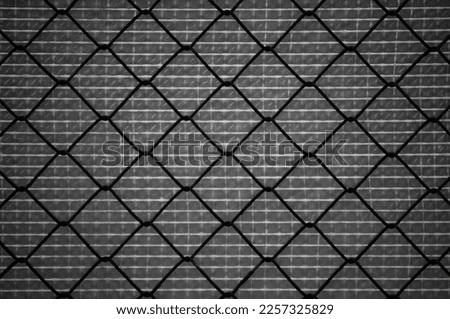 gray background, metal mesh close-up in the photo.