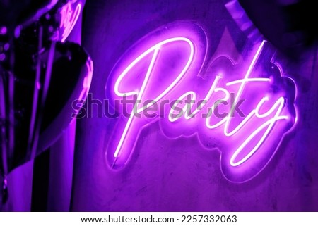 Extravagant bedroom luxury interior with love glamur decoration at Valentines day in studio. Balloons by heart shaped and at illuminated mirror romantic cozy atmosphere at vivid violet background.  Royalty-Free Stock Photo #2257332063