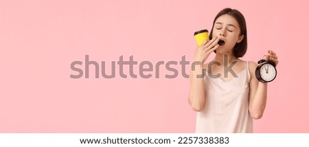 Yawning woman in pajamas, with alarm clock and cup of coffee on pink background with space for text