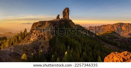 Panoramic view of Roque Nublo sacred mountain at sunset, Roque Nublo Rural Park, Gran Canary, Canary Islands, Spain Royalty-Free Stock Photo #2257346335