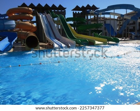 Water park with swimming pool. Many different slides.