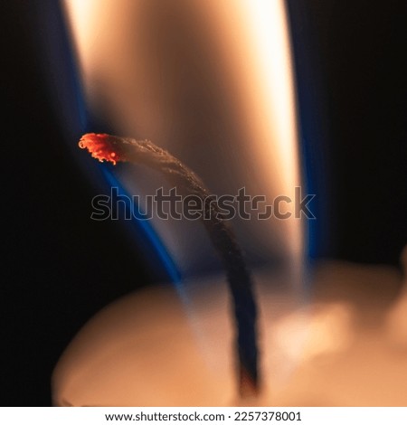 Burning candle wick close up. Selective focus.