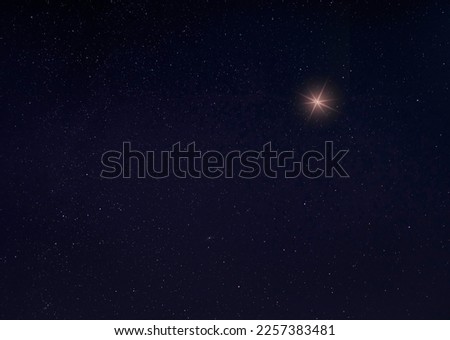Single bright star on a starry night with room for copy
