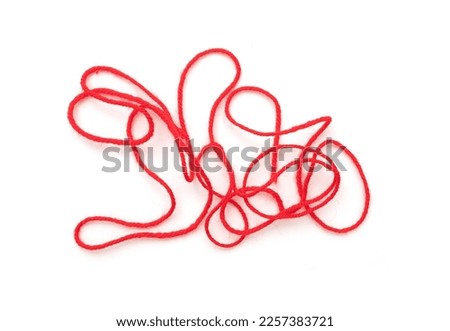Long bound thin red rope, string isolated on white, top view Royalty-Free Stock Photo #2257383721