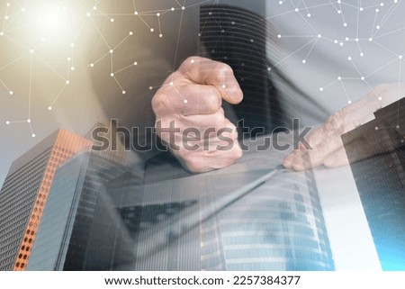 Angry businessman hitting his desk with his clenched fist; multiple exposure Royalty-Free Stock Photo #2257384377