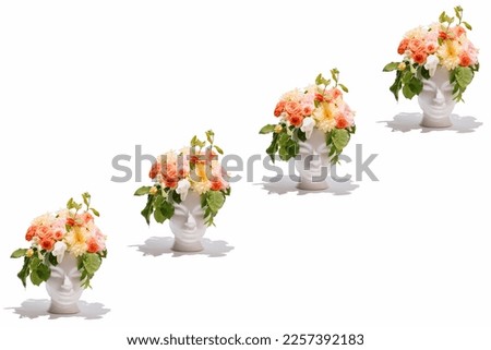 Fresh bunch of colorful flowers in human head shaped vases on  white background. Creativity, nature, spring and summertime concept. Royalty-Free Stock Photo #2257392183