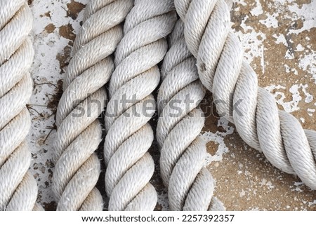 Rustic background rope background texture closeup of rope, rustic mood , white rope, white background Royalty-Free Stock Photo #2257392357