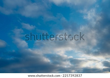 Blue sky with cirrus clouds.