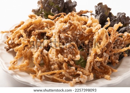 Deep-fried enoki mushrooms seasoned with garlic and ginger soy sauce