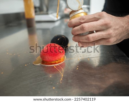 red velvet sprayed sweet cookie heart shaped stuffed with caramenl with golden brush strokes Royalty-Free Stock Photo #2257402119