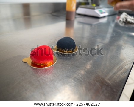 red velvet sprayed sweet cookie heart shaped stuffed with caramenl with golden brush strokes Royalty-Free Stock Photo #2257402129