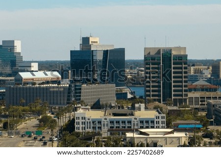 Aerial view of Jacksonville city with high office buildings. View from above of USA glass and steel high skyscraper architecture in modern american midtown