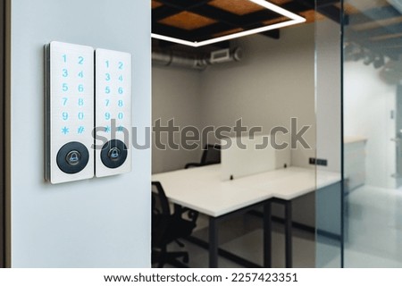 Electronic digital door lock on white office wall