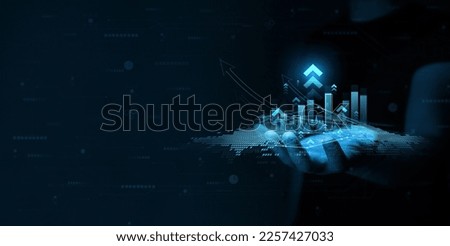 Businessman holding growth graph of business. Successful business, growth strategy and achieving goals with the rising arrow.  Royalty-Free Stock Photo #2257427033