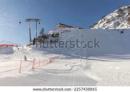 Slopes and skiers below the top station of the 5 laghi cable car, MADONNA DI CAMPIGLIO.