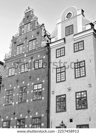 Black and white monochrome picture of two close buildings facade exterior