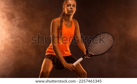 Tennis player. Download a photo to advertise your sports tennis academy for kids. Girl athlete teenager with racket. Sport concept.